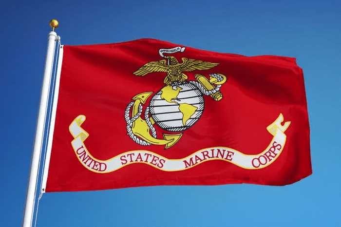 U.S. Marine Corps flag flying outdoors with Eagle, Globe and Anchor emblem