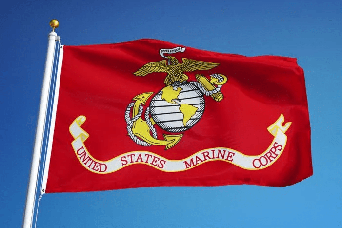 U.S. Marine Corps flag flying outdoors with Eagle, Globe and Anchor emblem