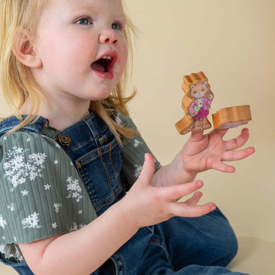 Children using wooden finger puppet characters for storytelling