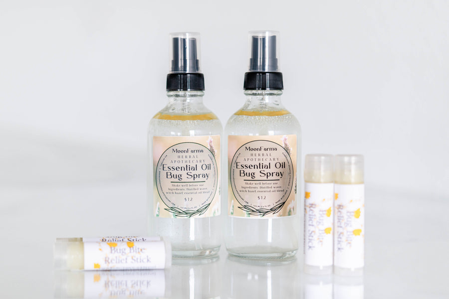 Botanical balm sticks displayed alongside insect repellent spray