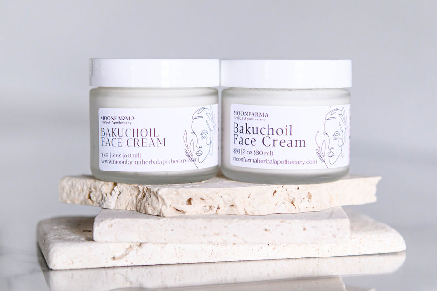 Two jars of bakuchiol face cream on a display stand