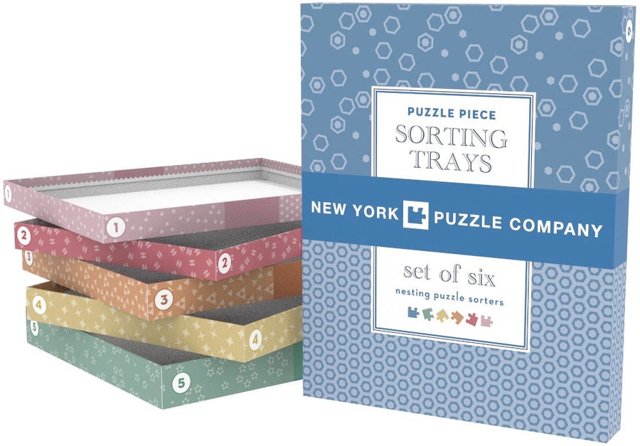 Stacked colorful puzzle sorting trays with printed cover