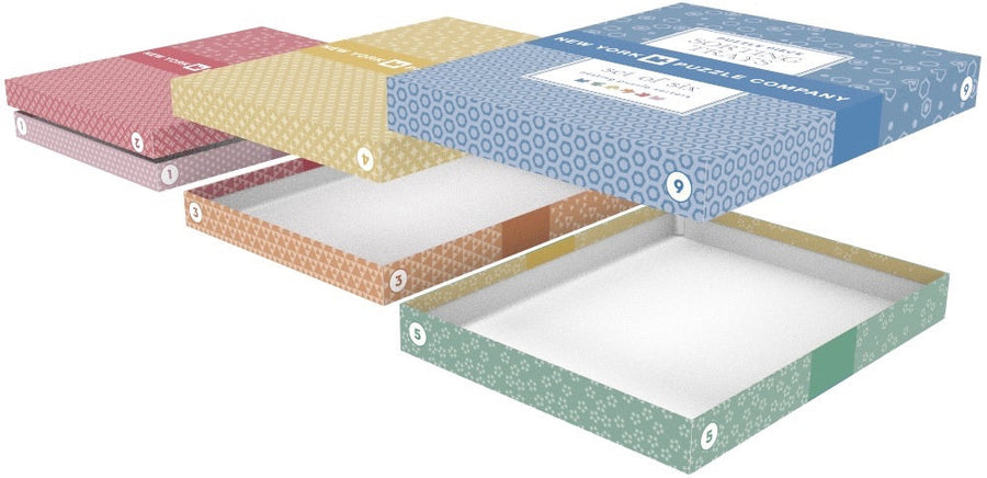 Six colorful puzzle sorting trays arranged separately