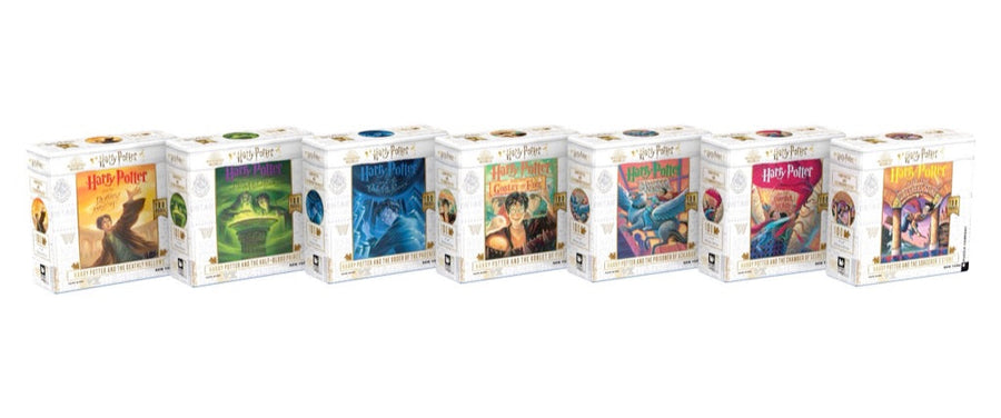 Seven Harry Potter book-cover mini puzzle boxes in a row