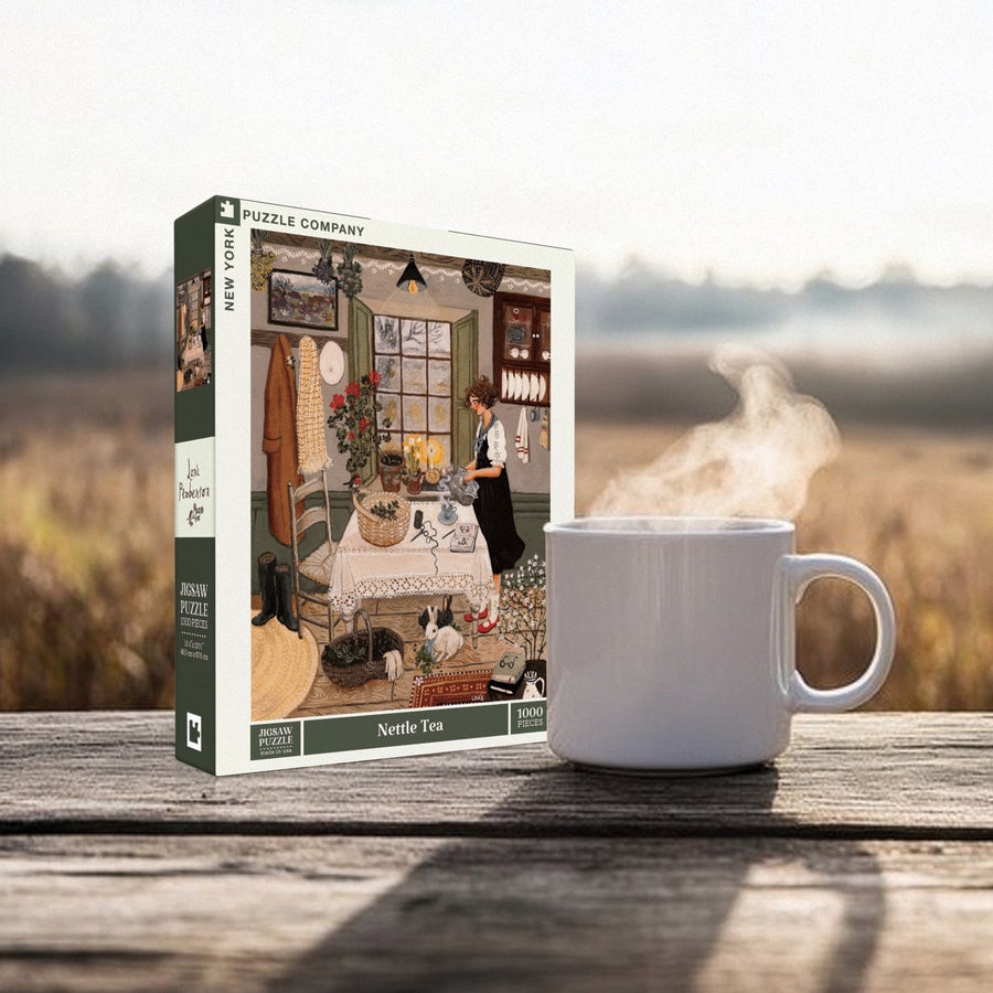 Nettle Tea puzzle box styled beside a mug