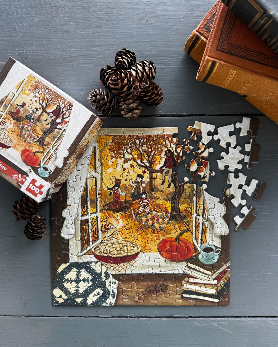 Autumn’s Window Mini puzzle and pieces on a tabletop