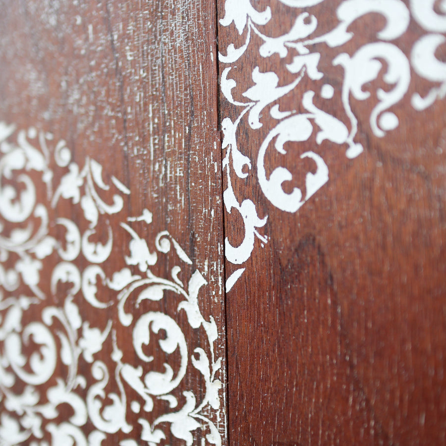 Heart of Filigree art print with a pale ornamental heart against brown wood imagery.