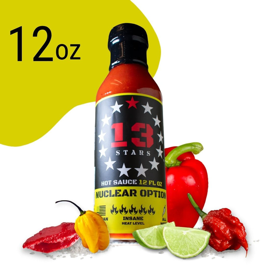 Nuclear Option 12 oz hot sauce bottle with peppers and lime