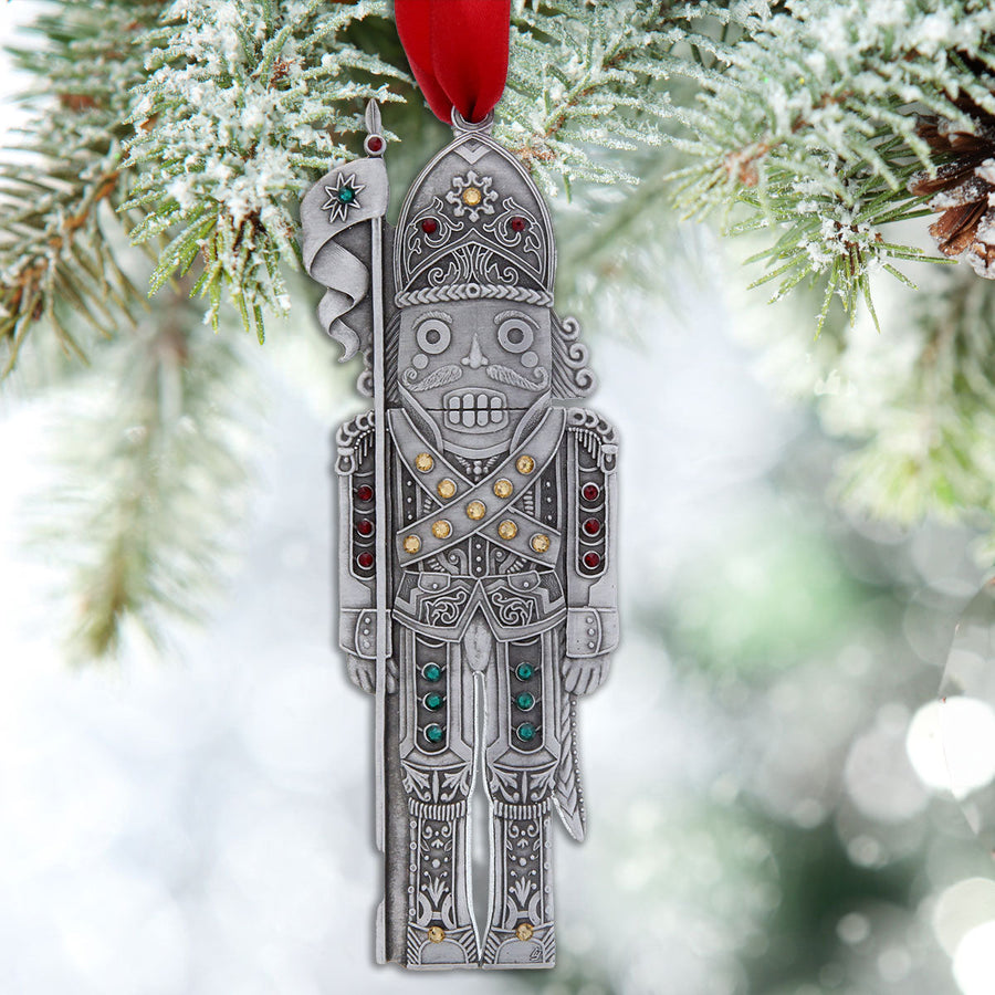 Styled display featuring The Nutcracker Knight Christmas Ornament - Aluminum