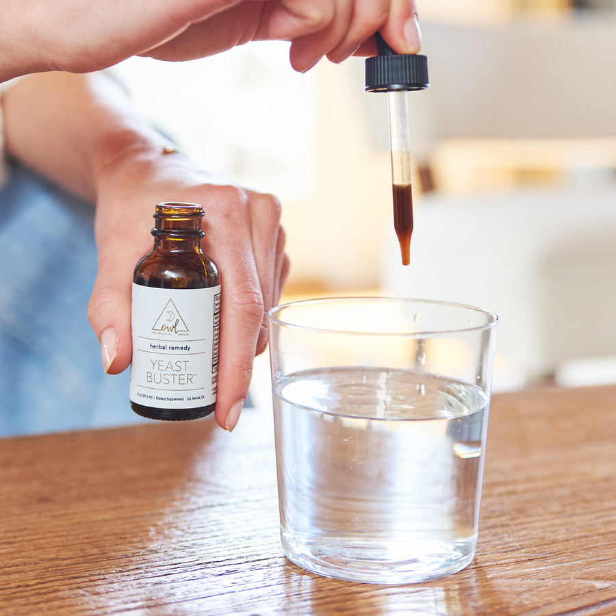 Yeast Buster tincture being added to a glass of water
