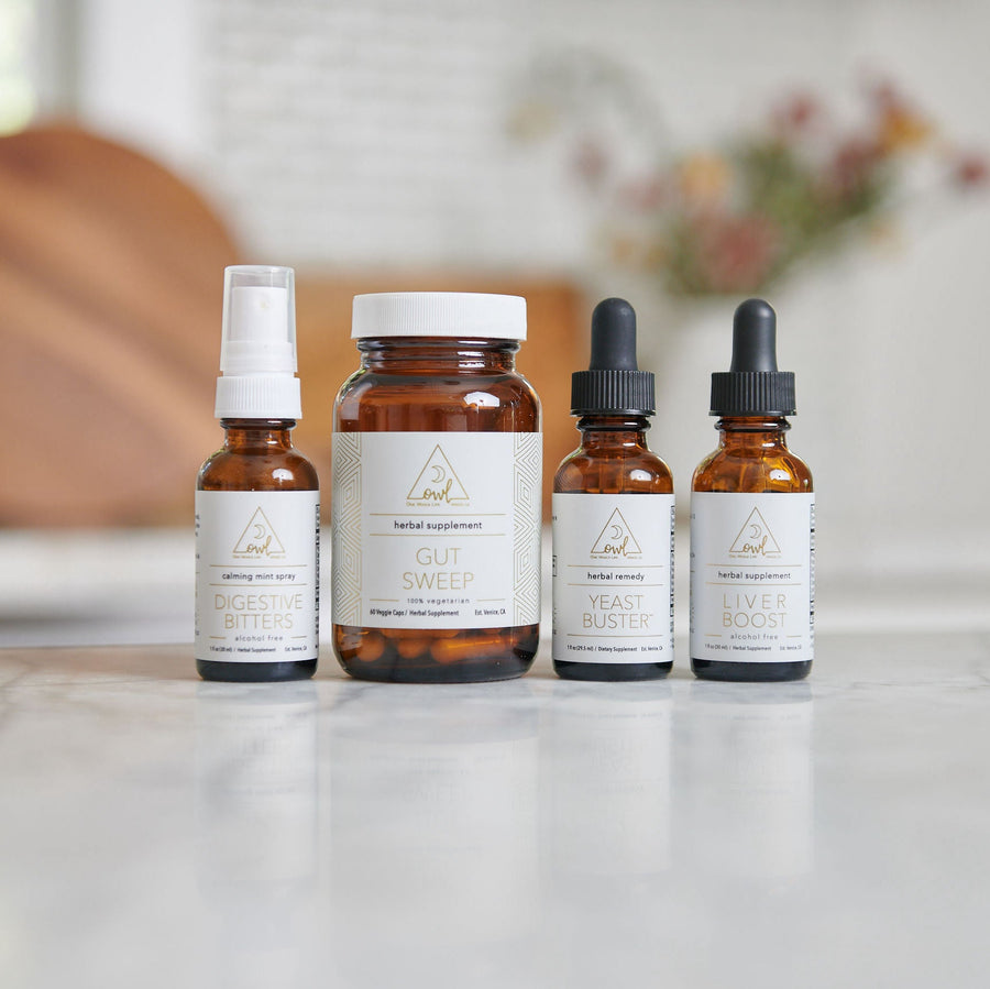 Older four-bottle OWL supplement assortment with spray, capsules and two tinctures