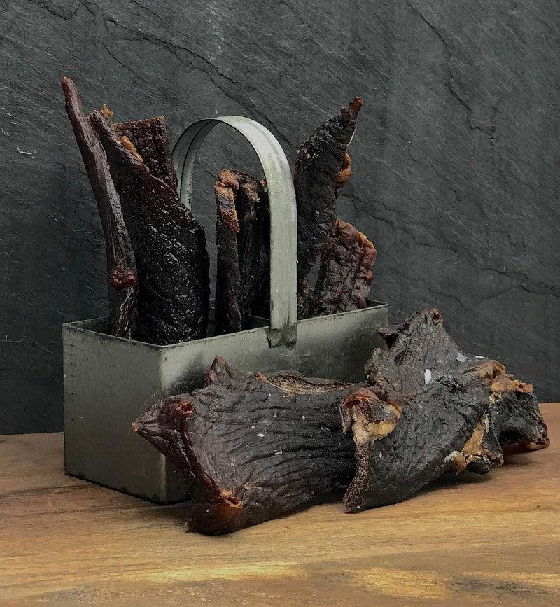 Original Elk Jerky, dried elk strips displayed in a metal carrier