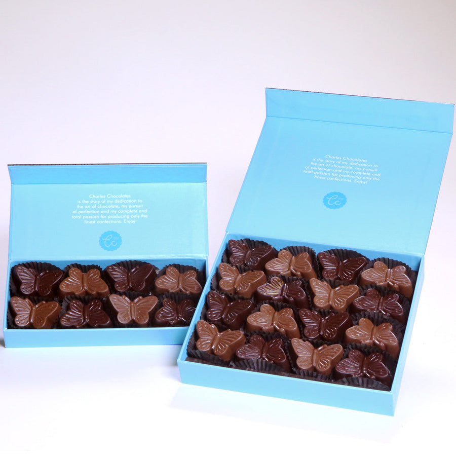 Two open boxes of Peanut Praline Chocolate Butterflies