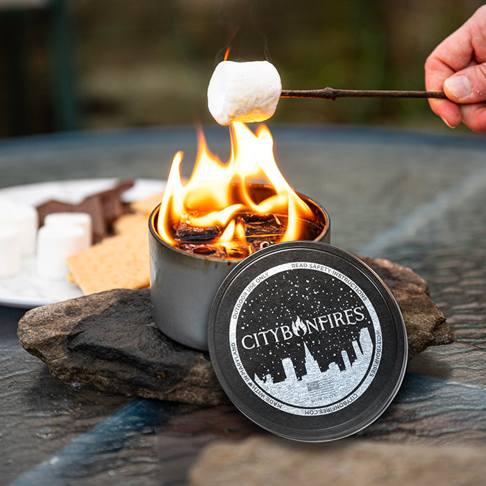 Marshmallows roasting over a separate portable bonfire