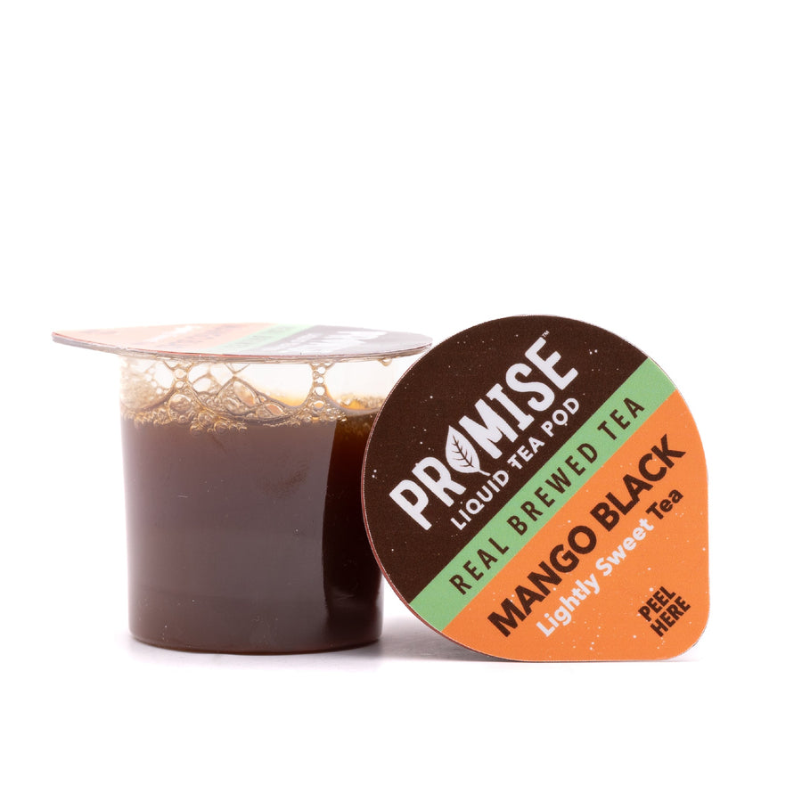 Open Mango Black tea pod beside its lid