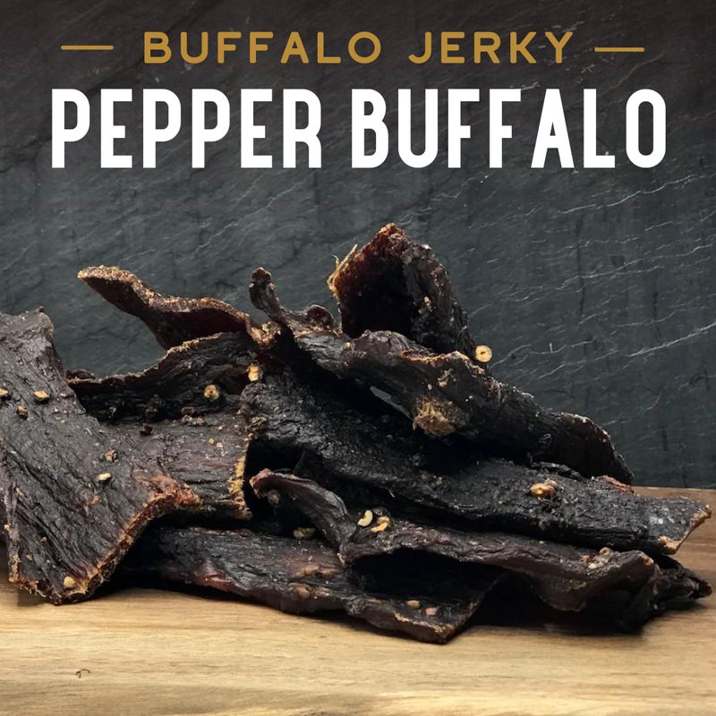 Pepper Buffalo Jerky, promotional photo with peppercorns and strips