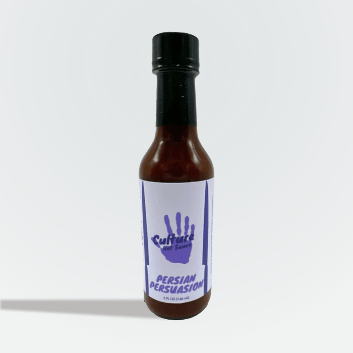Persian Persuasion hot sauce bottle with a purple handprint label