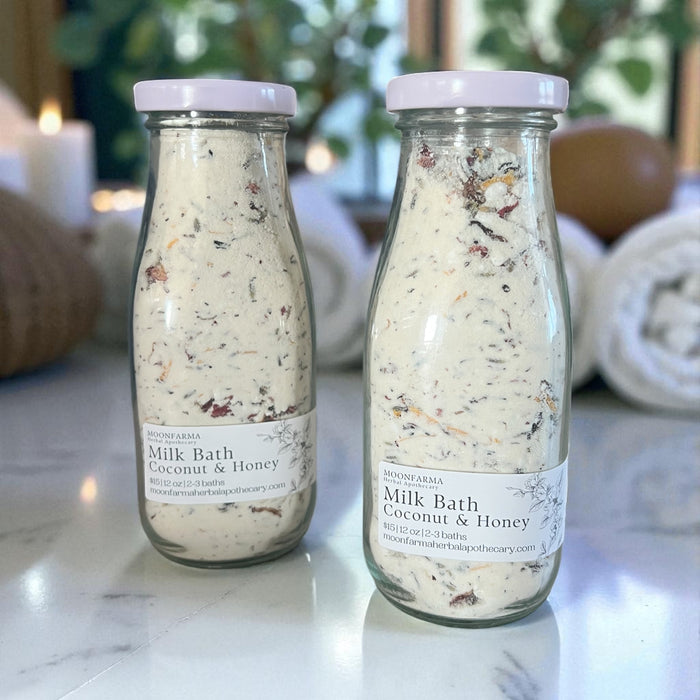 Two bottles of coconut and honey botanical milk bath