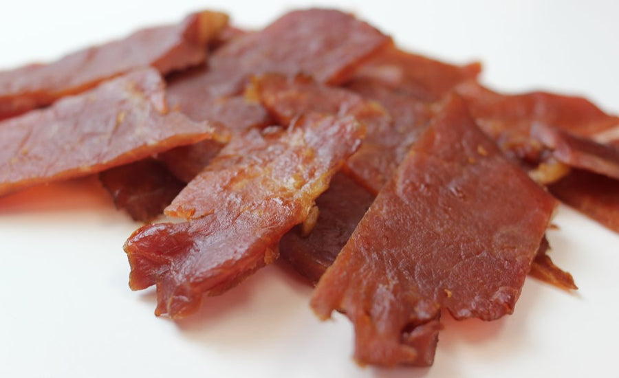 Thin pork jerky slices shown in a close-up