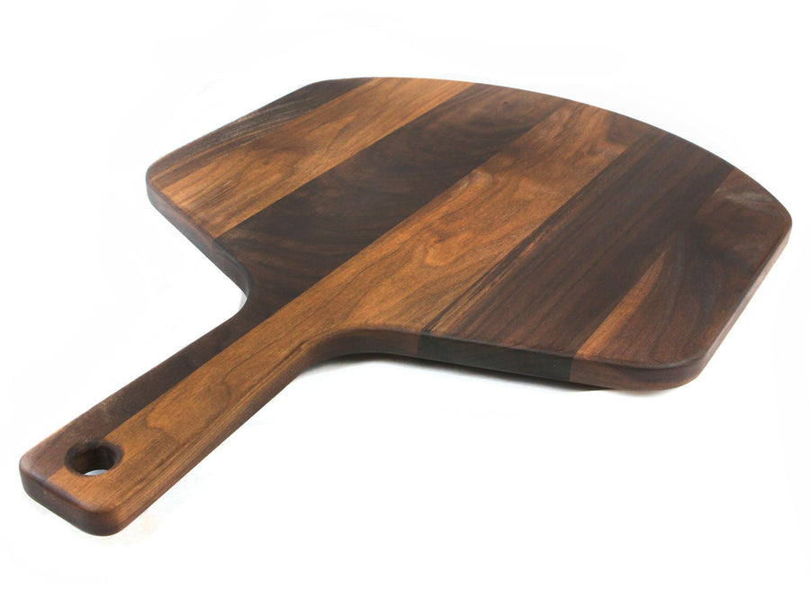 Angled view of the walnut pizza peel and long handle