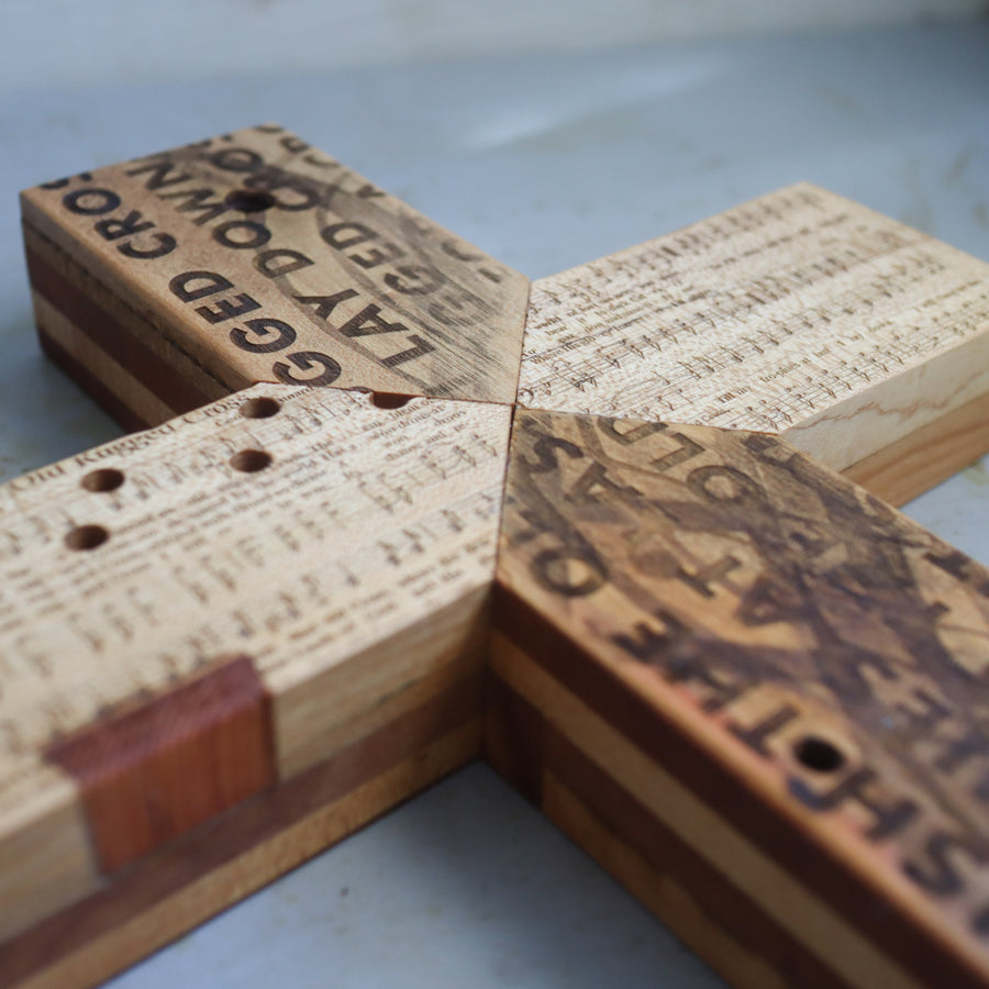Reclaimed piano wood cross engraved with Old Rugged Cross hymn imagery.