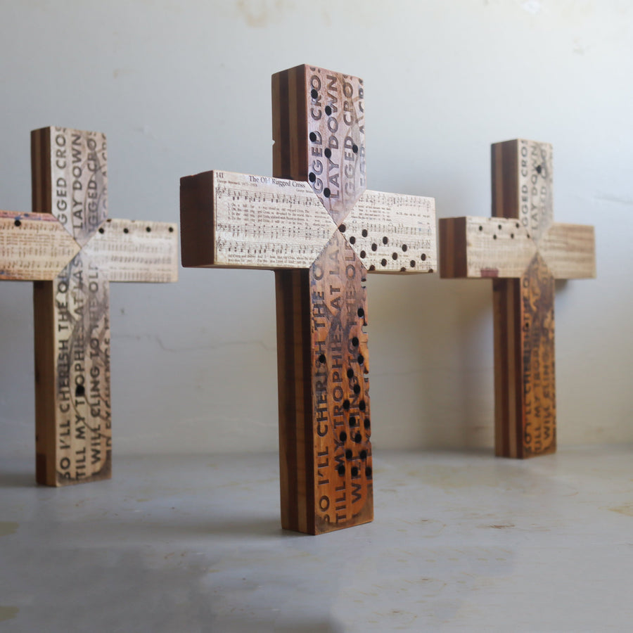 Reclaimed piano wood cross engraved with Old Rugged Cross hymn imagery.