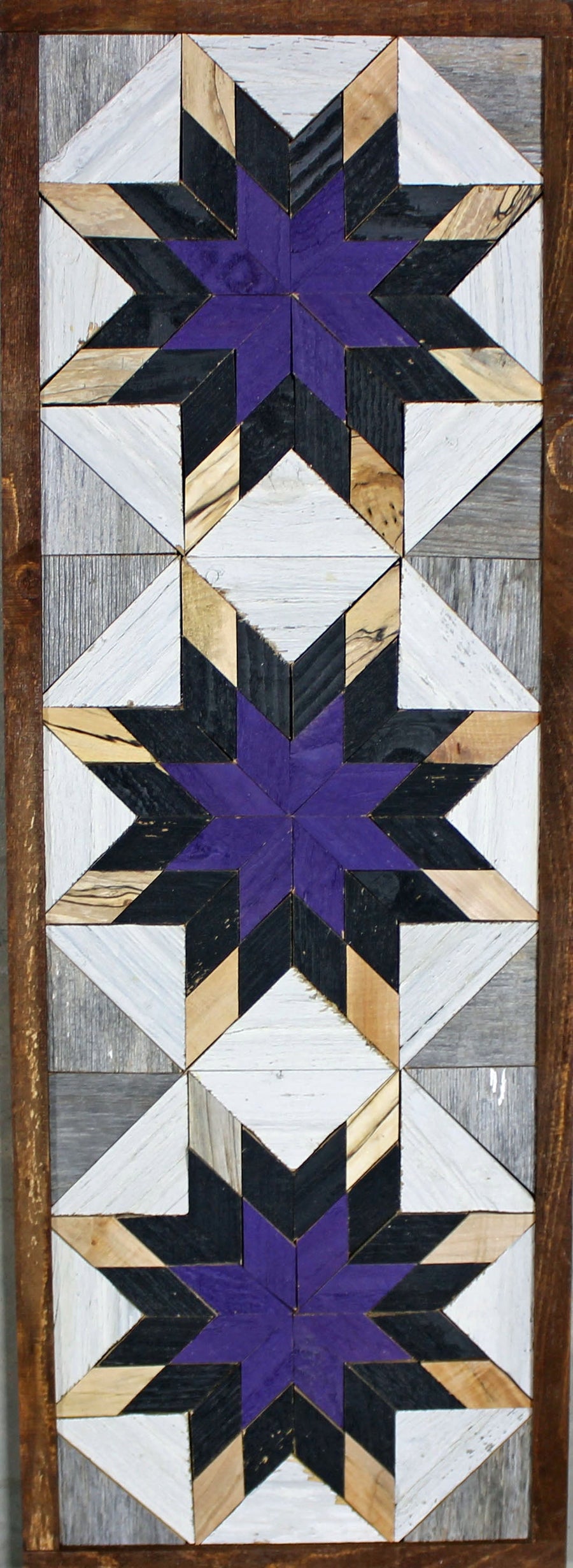 Tall reclaimed-wood barn quilt banner with a hand-painted geometric star design