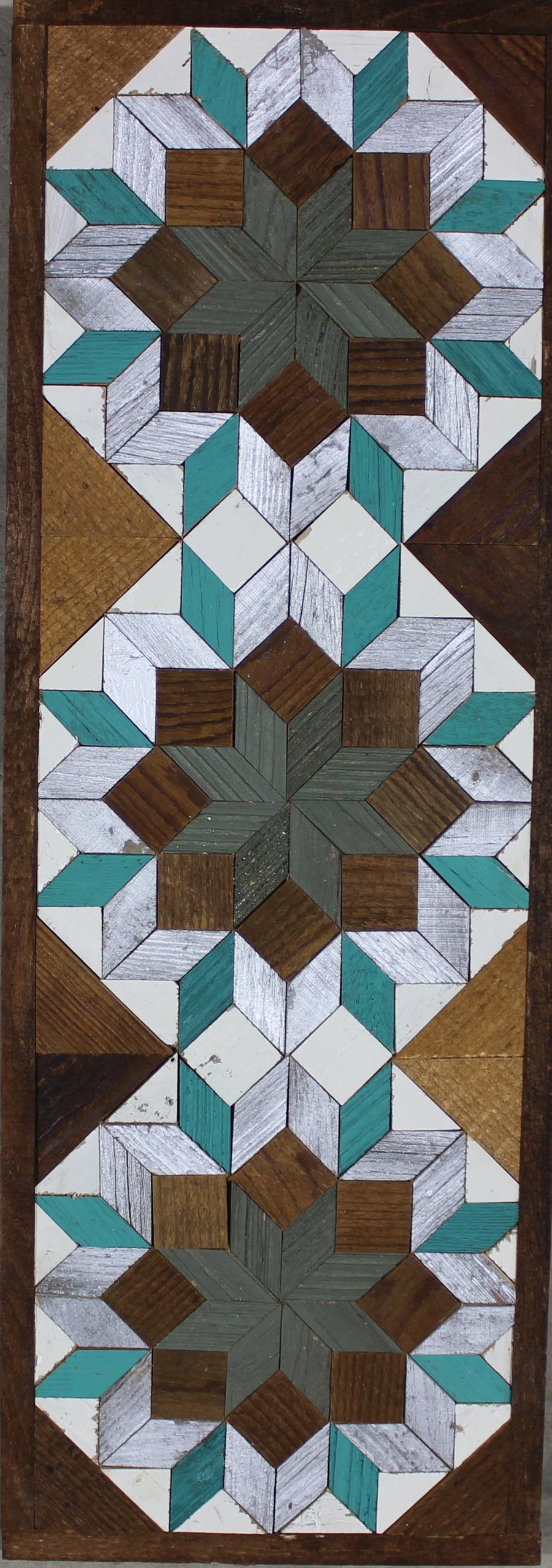 Tall reclaimed-wood barn quilt banner with a hand-painted geometric star design