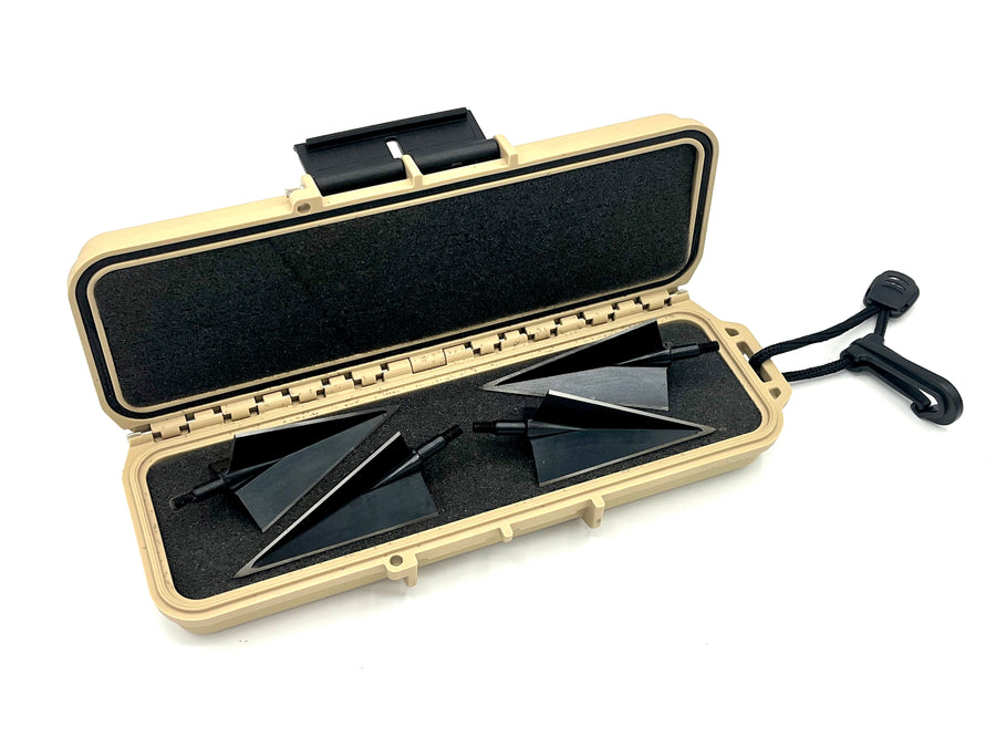 Large two-blade broadheads arranged in the tan case