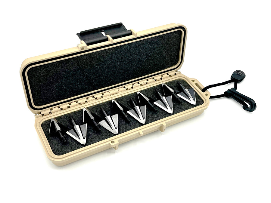 Open tan case with small two-blade broadheads in the foam