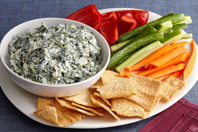 Spinach Parmesan dip served with vegetables and crackers