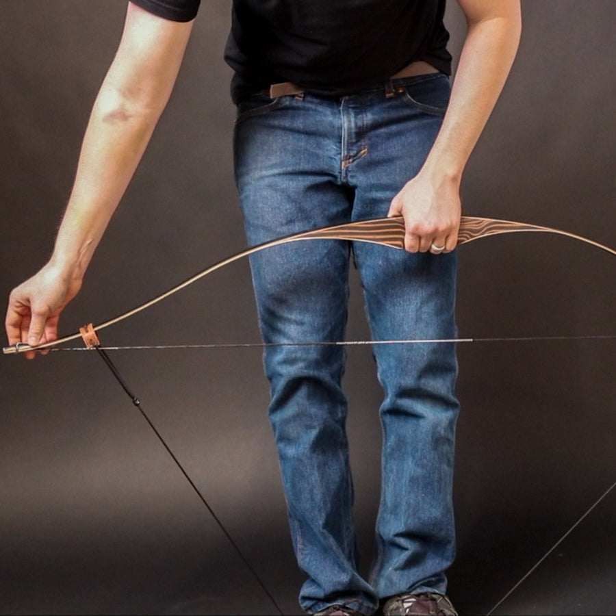Leather Bow Stringer for Recurve Bows & Longbows — bow stringer in use on a traditional bow