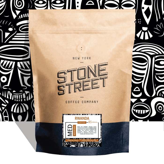 Rwanda Kinini coffee bag pictured against a colorful patterned background