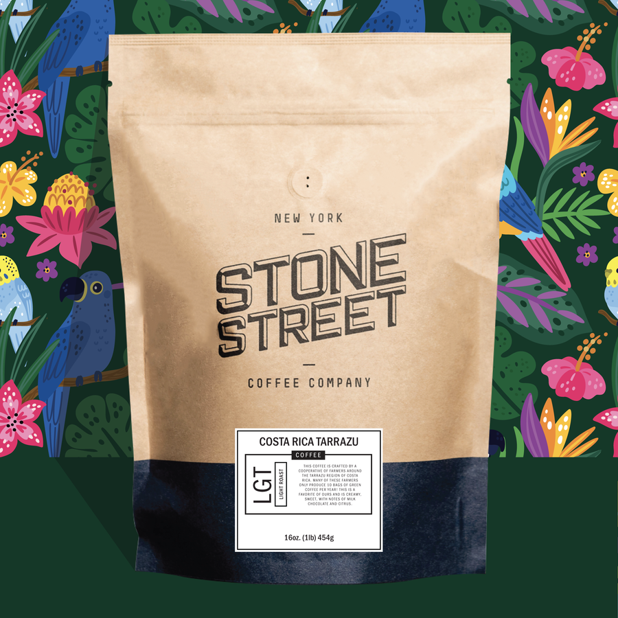 Costa Rica Tarrazu coffee bag pictured against a colorful patterned background