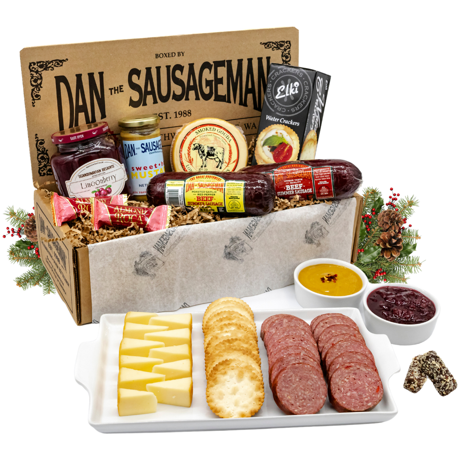 Skandia sausage, cheese and lingonberry gift box with holiday greenery; serving display