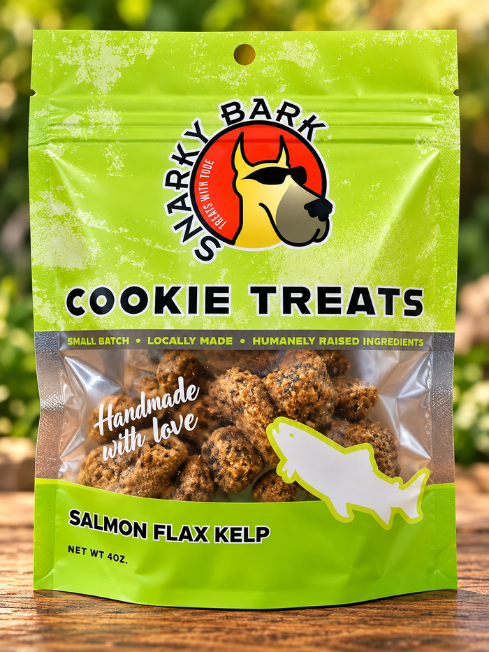 Snarky Bark salmon flax kelp cookie treats in a green pouch with a fish silhouette