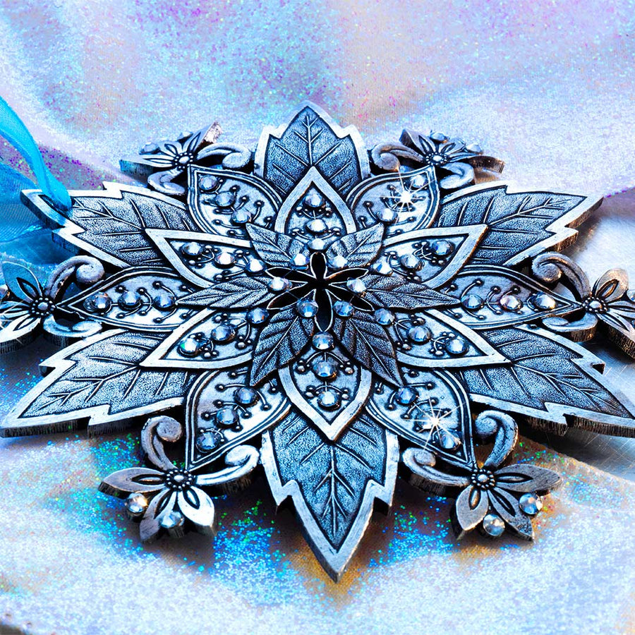 Styled display featuring Snow Crystal Poinsettia Ornament
