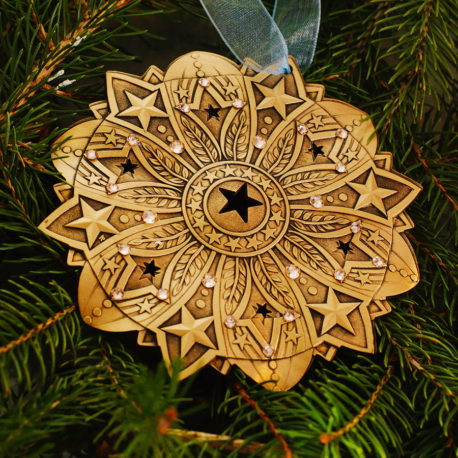 Styled display featuring Star Spangled Snow Crystal 2026 Ornament