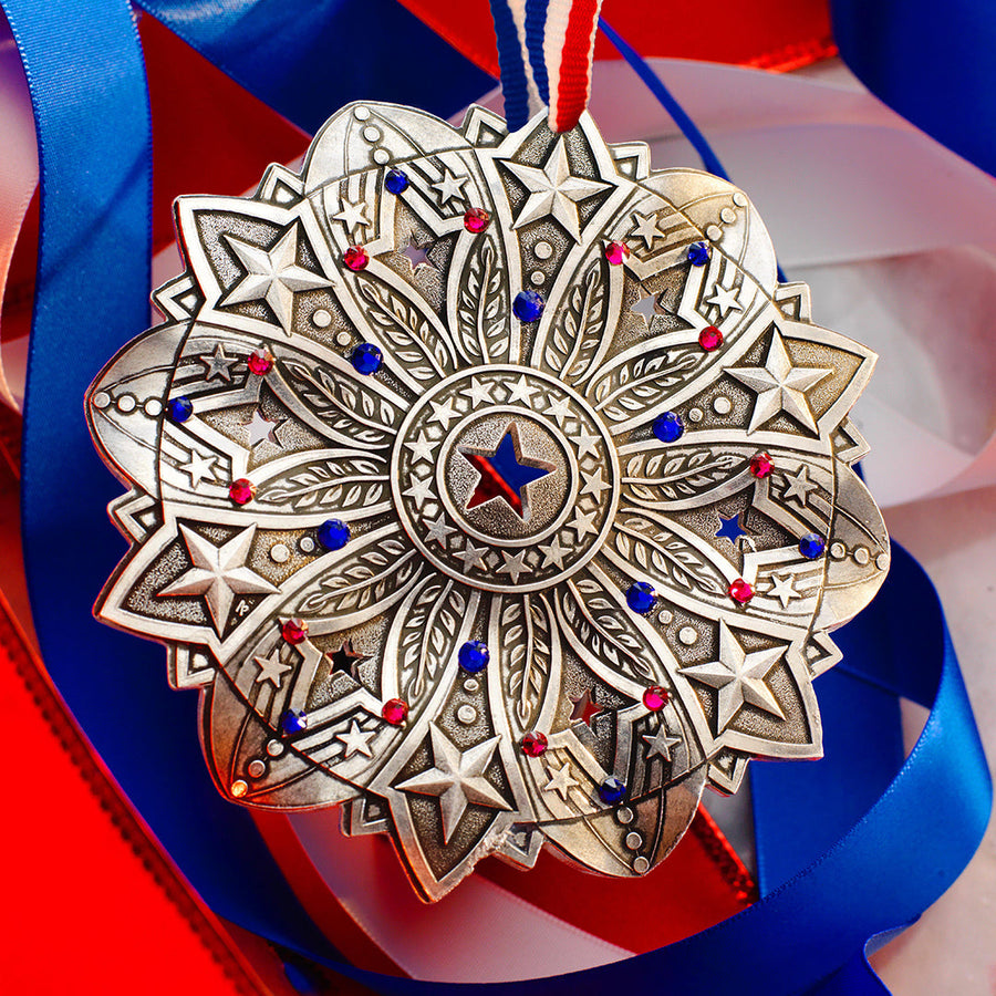Styled display featuring Star Spangled Snow Crystal 2026 Ornament (America250)