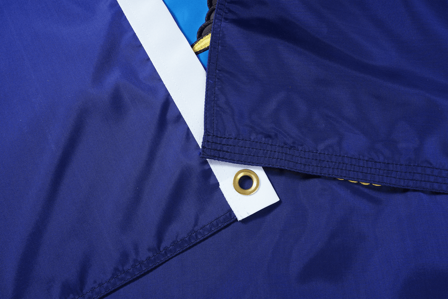 U.S. Navy flag stitching, reinforced header and brass-colored grommet