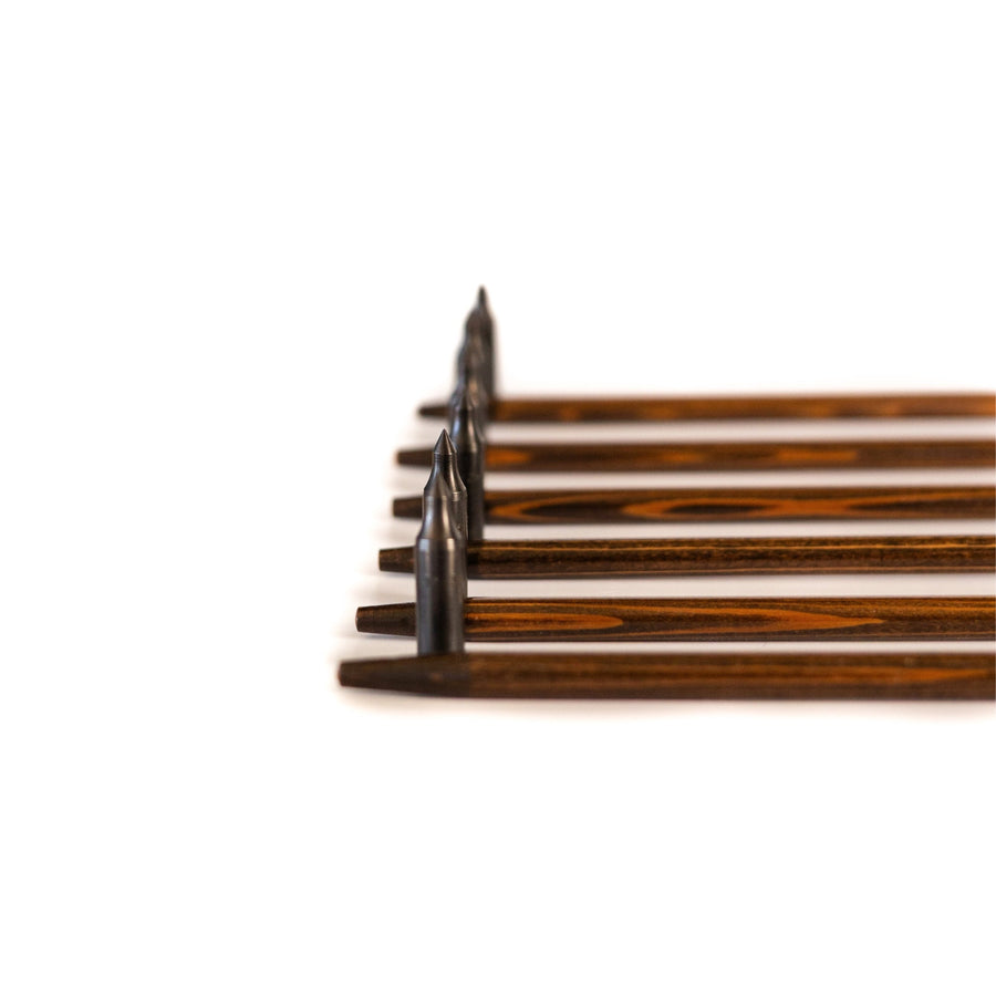 USA-Made Western Larch Wood Arrows — field points aligned in a row