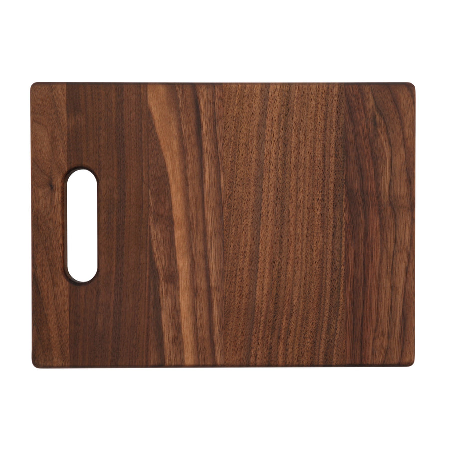 Compact walnut board with one cutout handle, overhead view