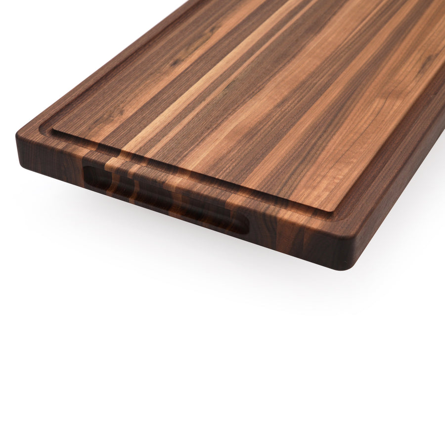 Walnut edge-grain cutting board showing its thick profile