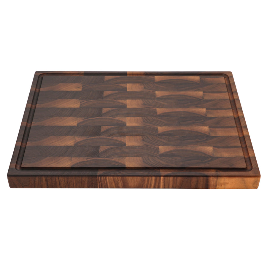 Walnut end-grain cutting board photographed at a low angle