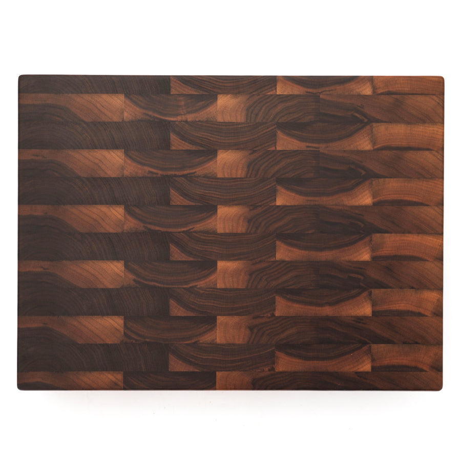 Walnut end-grain cutting board showing a plain working surface