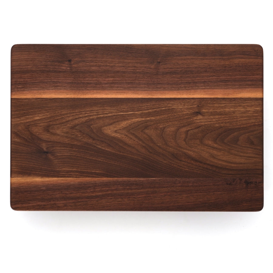Overhead view of a plain rectangular walnut cutting board