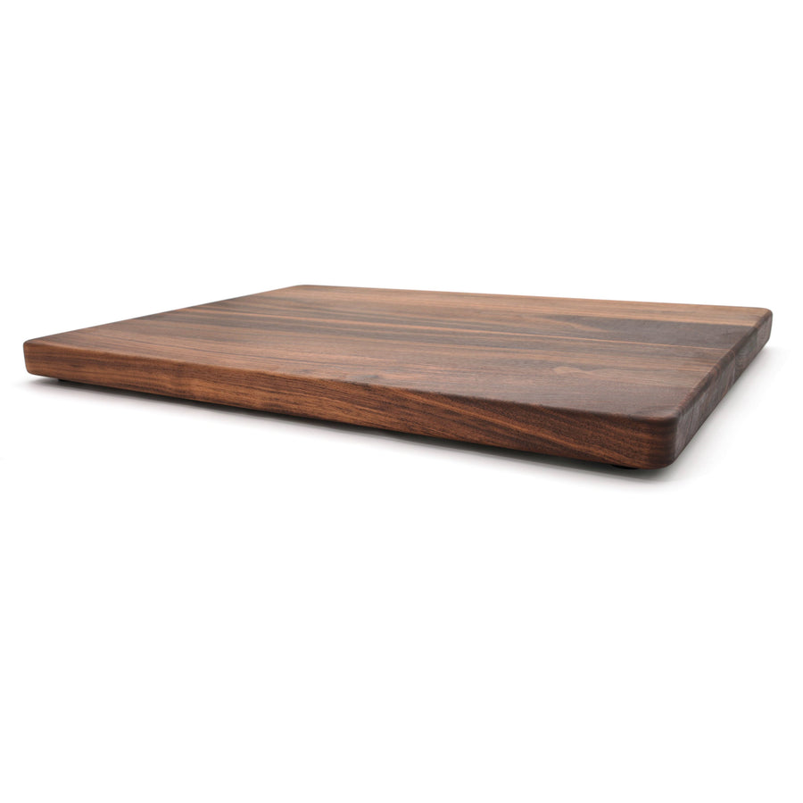 Thick walnut cutting board showing its low side profile