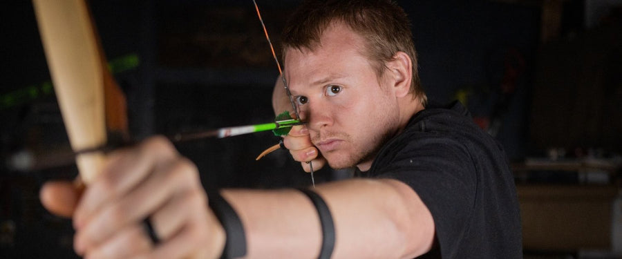 B55 Custom Flemish Twist Bowstring — archer drawing bow in demonstration