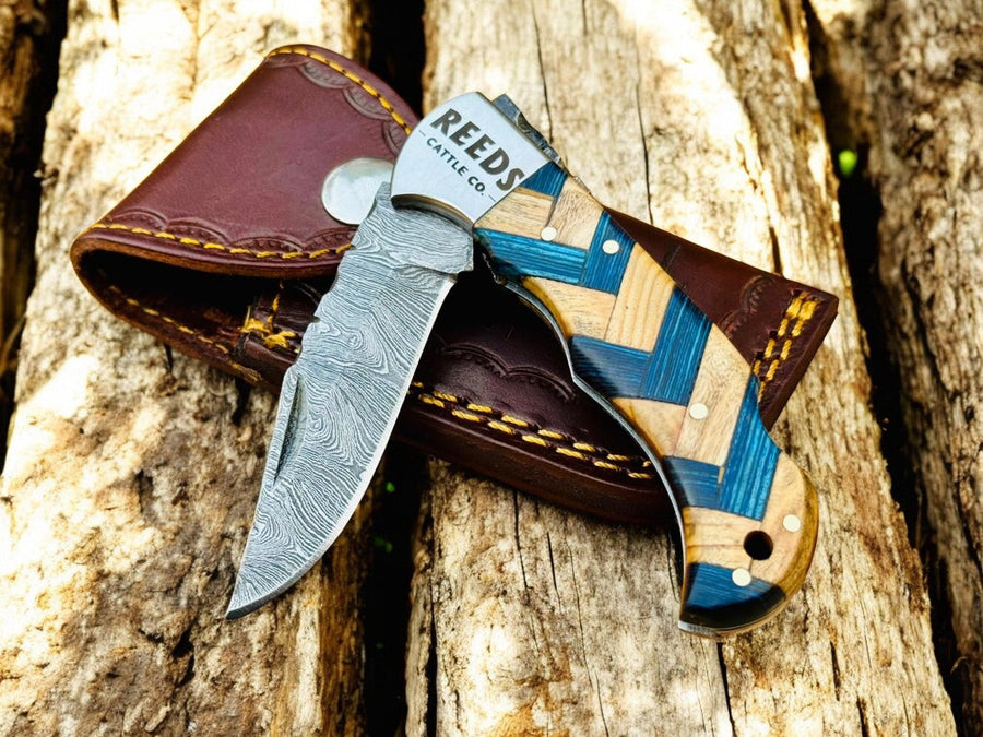 Damascus Pocket Knife – 3" Blade, Olivewood + Exotic Blue Pakka Wood product photo