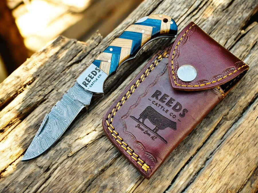Damascus Pocket Knife – 3" Blade, Olivewood + Exotic Blue Pakka Wood product photo